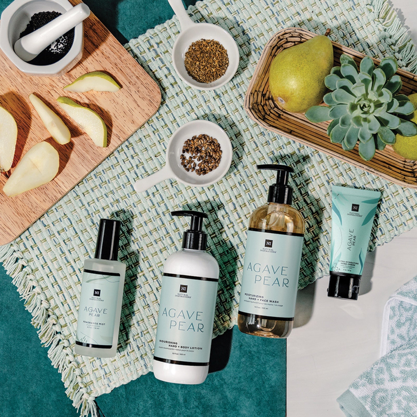 overhead view of agave pear products with sliced pears and exseed ingredients on a teal background