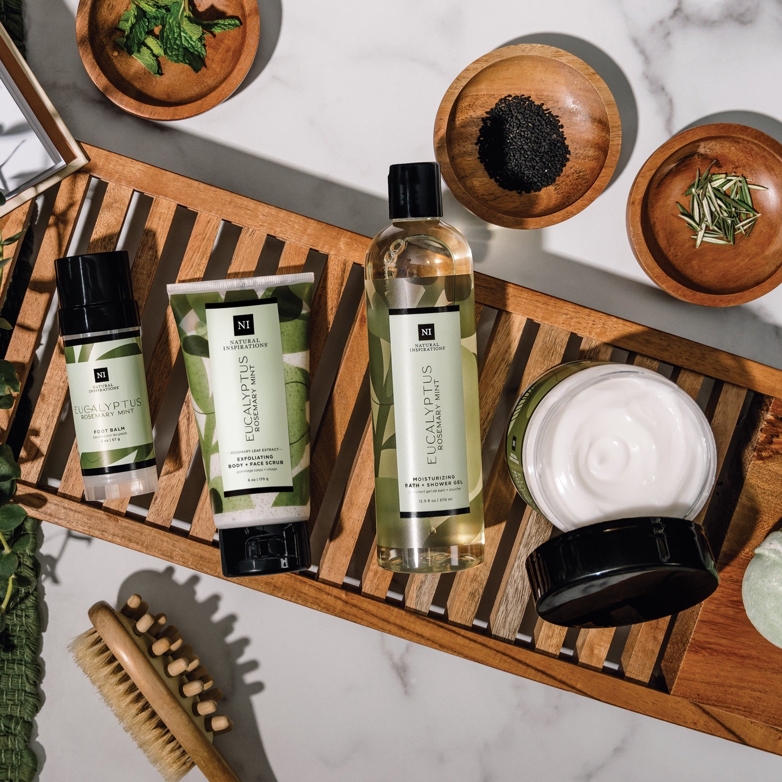 overhead view of eucalyptus rosemary mint products in a bathroom setting