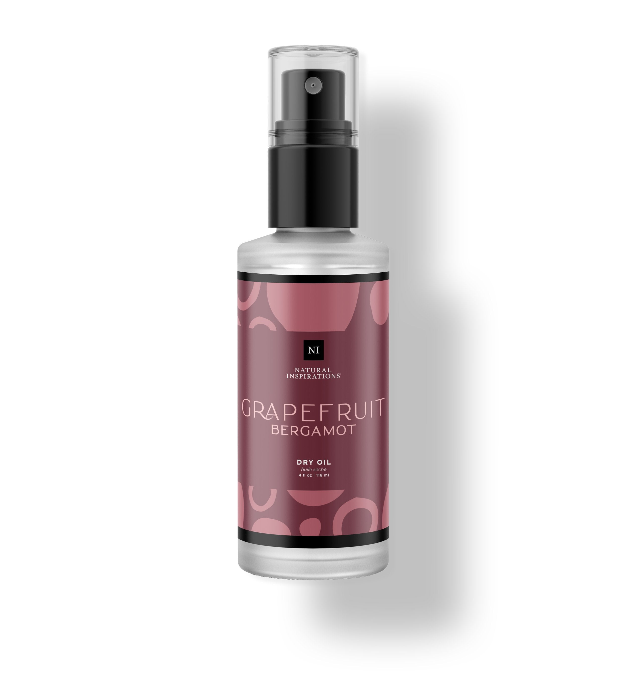 Natural Inspirations Grapefruit Bergamot Body and Face Dry Oil frosted glass bottle on a white background.