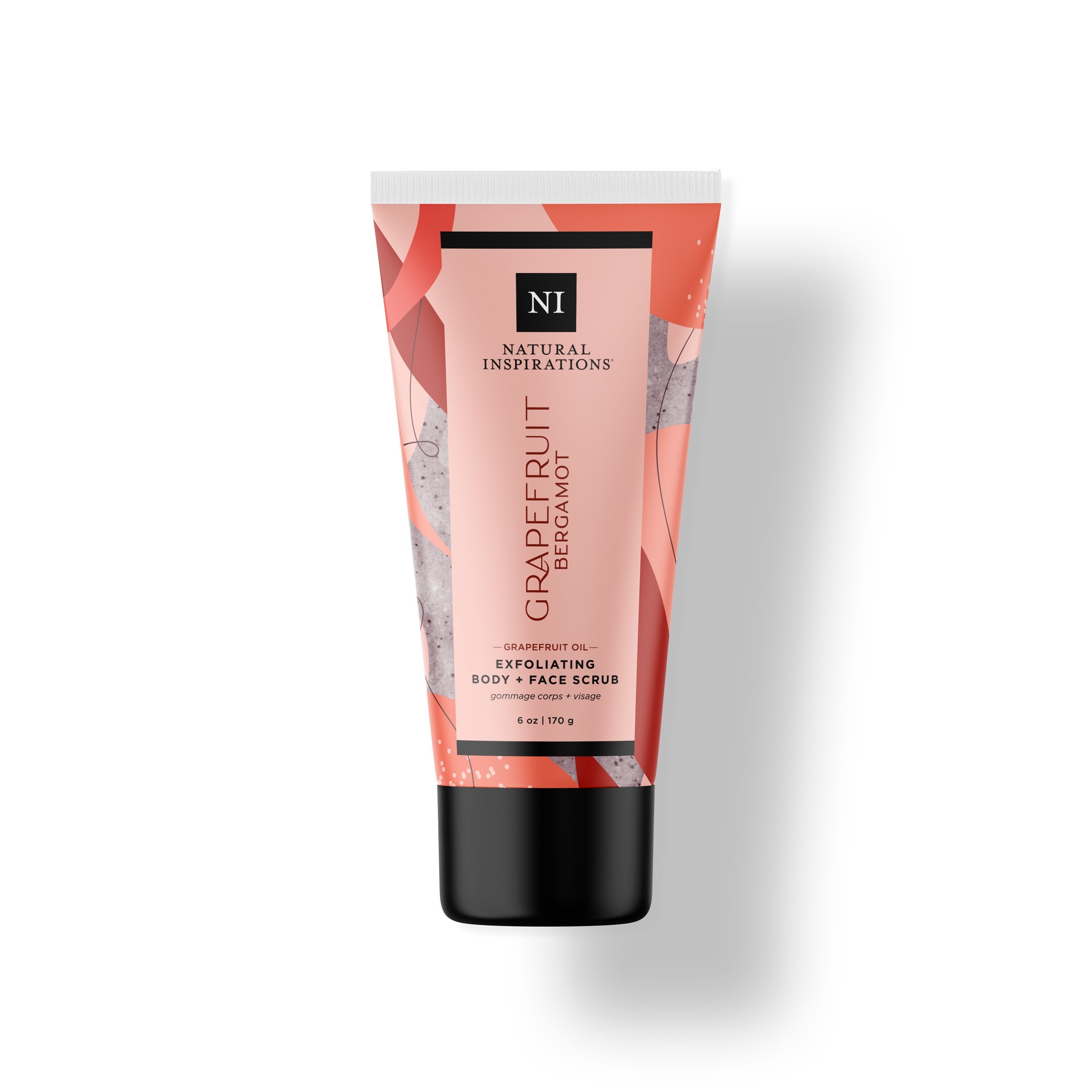Natural Inspirations Grapefruit Bergamot Face and Body Scrub tube on a white background.