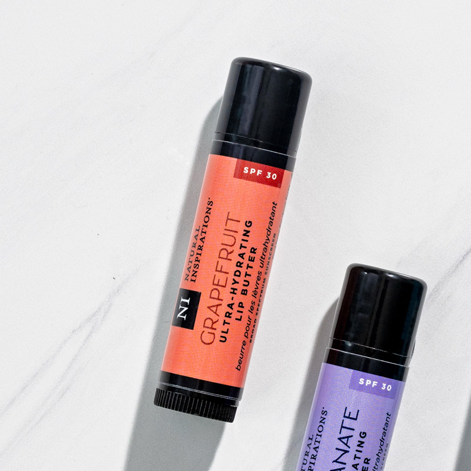 overhead view of lip butter with Grapefruit flavor in focus