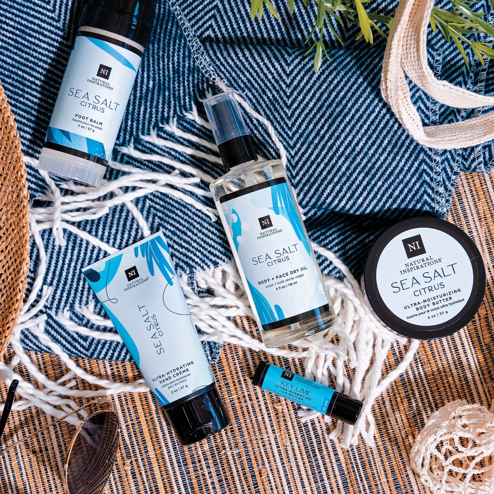 overhead view of sea salt citrus products in a beach-themed setting