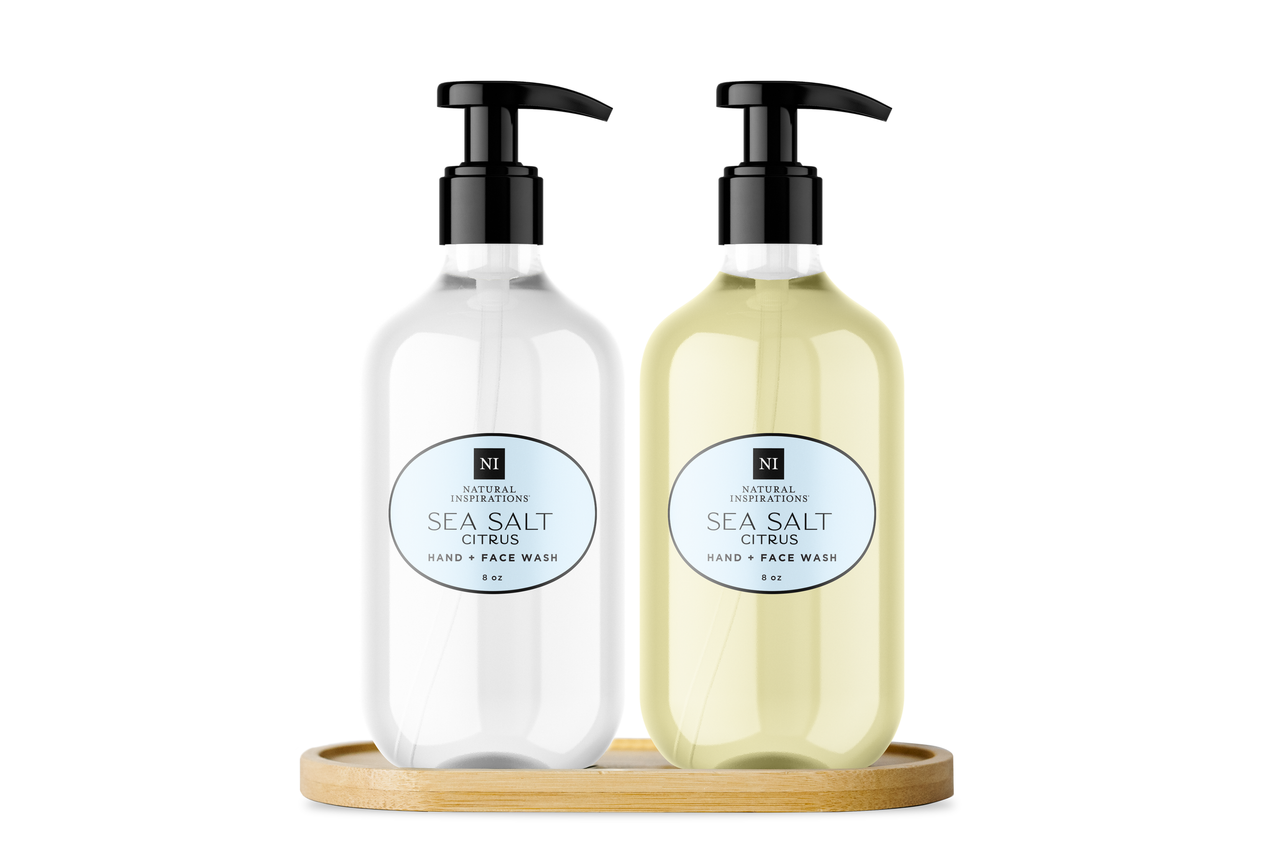 Natural Inspirations Sea Salt Citrus Sink Set showing our hand and body lotion and hand and face wash in glass bottles displayed on a bamboo tray on a white background.