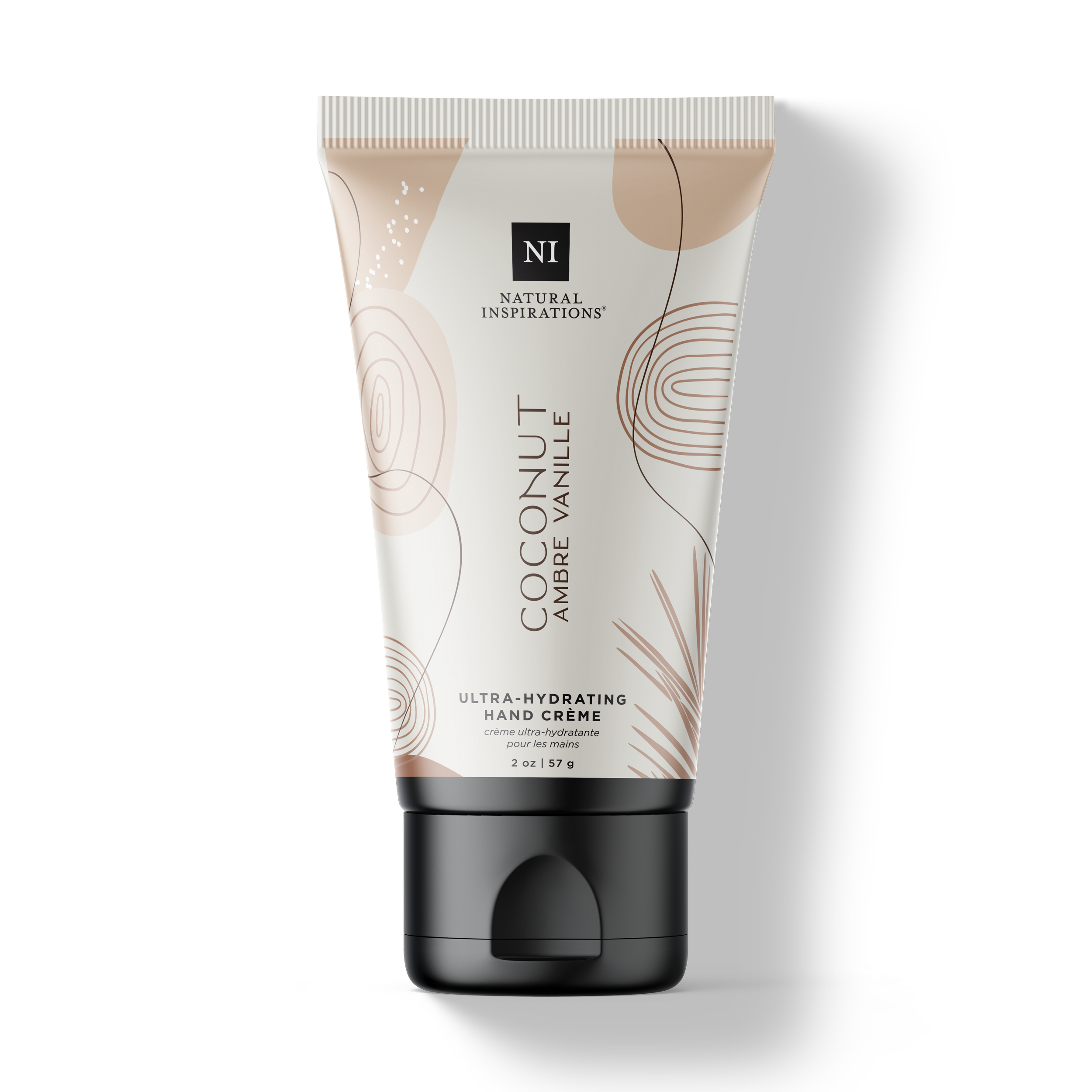 Natural Inspirations Coconut Ambre Vanille Mini Hand Cream tube on a white background.