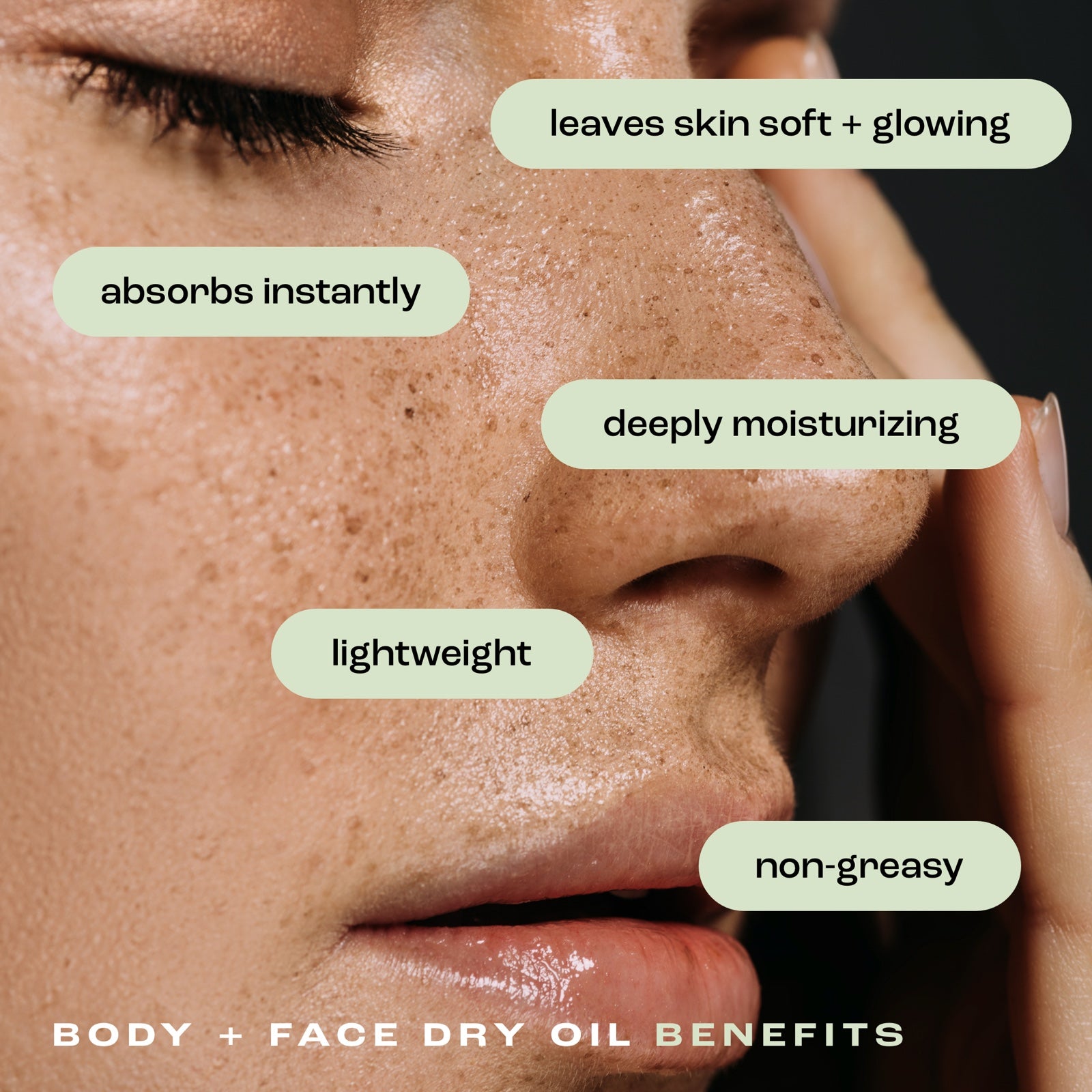 close up of a woman's face showcasing the benefits of body and face dry oil: leaves skin soft and glowing, absorbs instantly, deeply moisturizing, lightweight and non-greasy