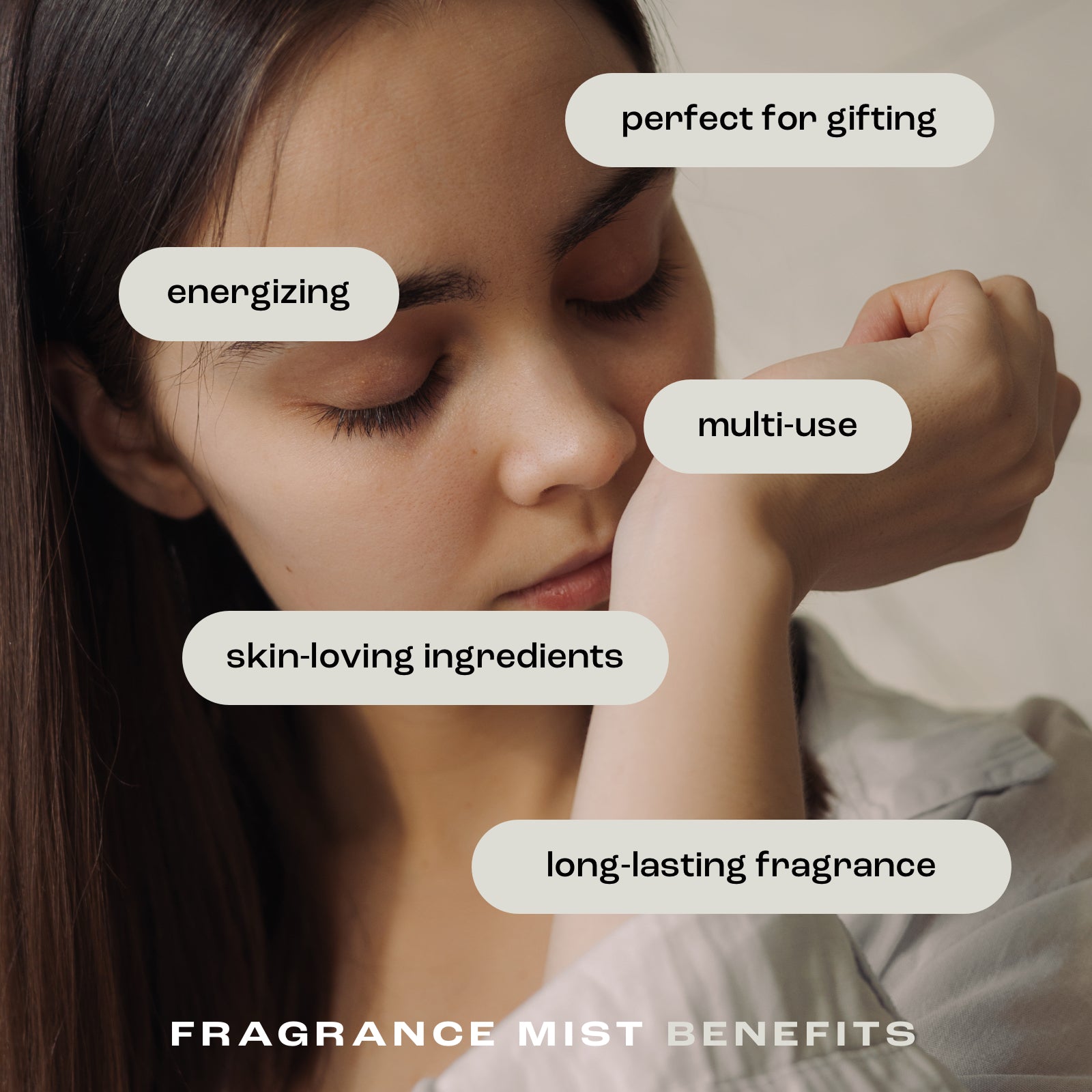 woman smelling her wrist with the listed fragrance mist benefits: perfect for gifting, energizing, multi-use, skin-loving ingredients and long-lasting fragrance
