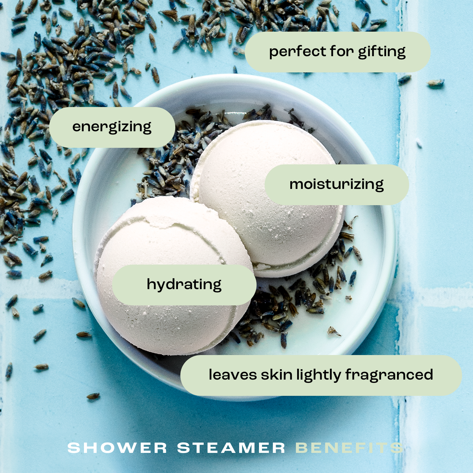 overhead view of shower steamers in a dish on a tile background with the listed benefits: perfect for gifting, energizing, moisturizing, hydrating and leaves skin lightly fragranced