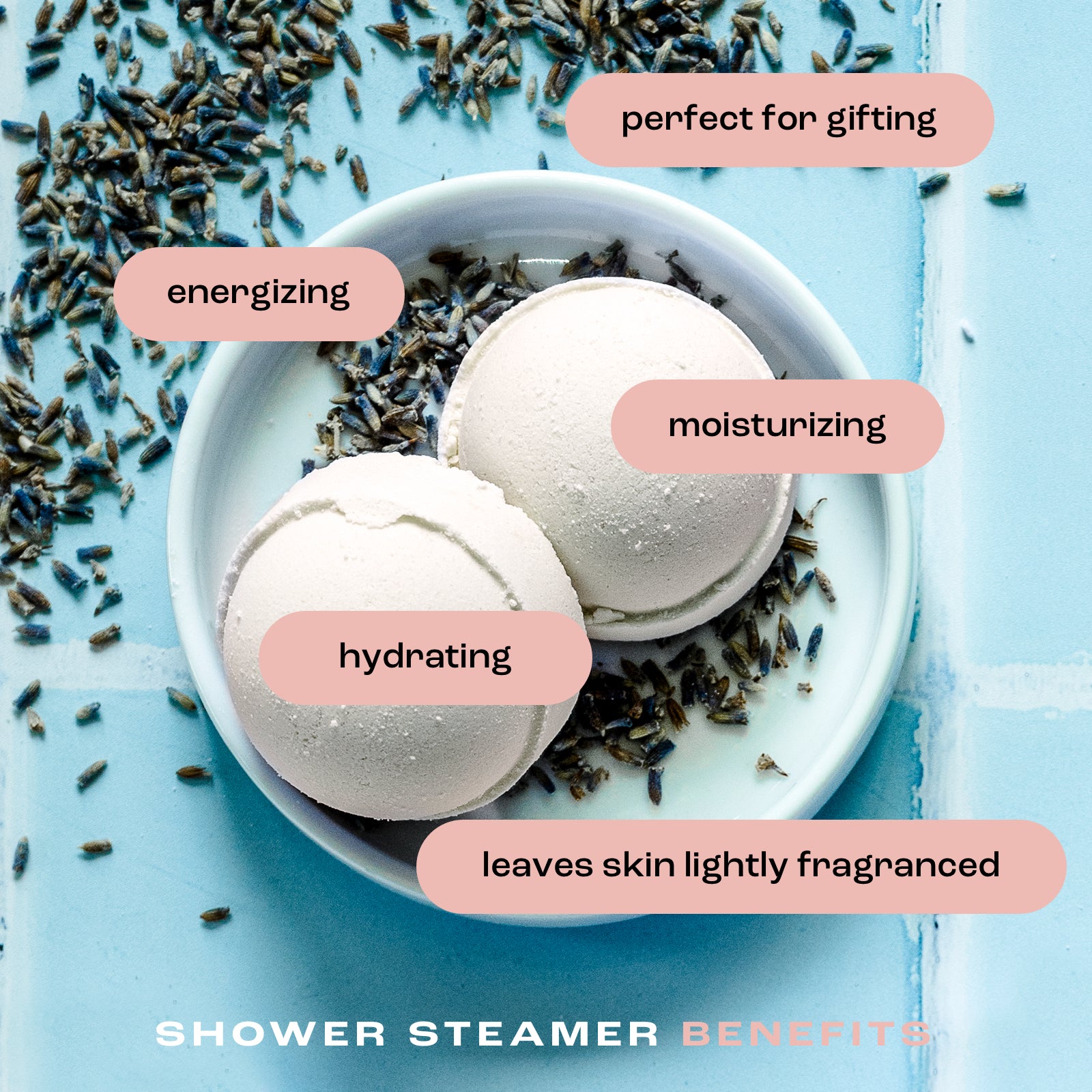 overhead view of shower steamers in a dish on a tile background with the listed benefits: perfect for gifting, energizing, moisturizing, hydrating and leaves skin lightly fragranced