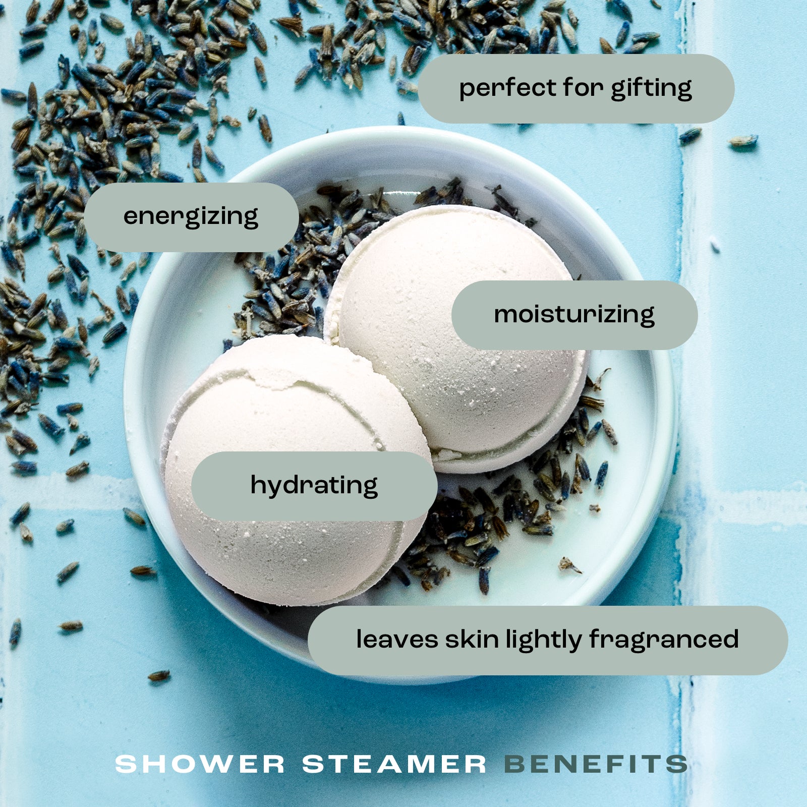 overhead view of shower steamers in a dish on a tile background with the listed benefits: perfect for gifting, energizing, moisturizing, hydrating and leaves skin lightly fragranced